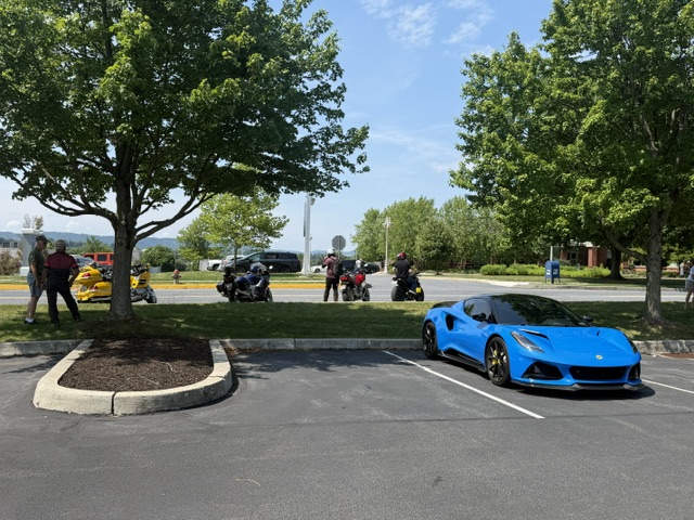 Blue Lotus sports car displayed at Cars and Coffee in Wyomissing, Pennsylvania.