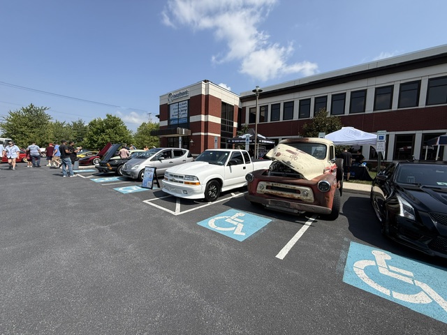 Cars lined up outside Riverfront Federal Credit Union during Cars and Coffee in Wyomissing PA.