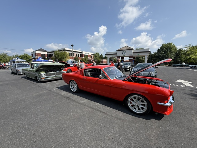 Red classic Mustang displayed at Cars and Coffee in Wyomissing PA.